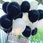 Black and white helium balloons