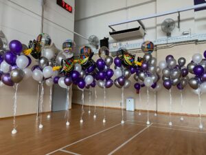 grad foil with helium balloons