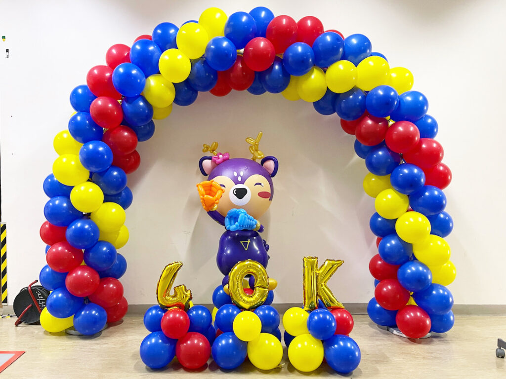 Blue red and yellow balloon arch