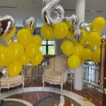 Yellow helium balloon with silver foil